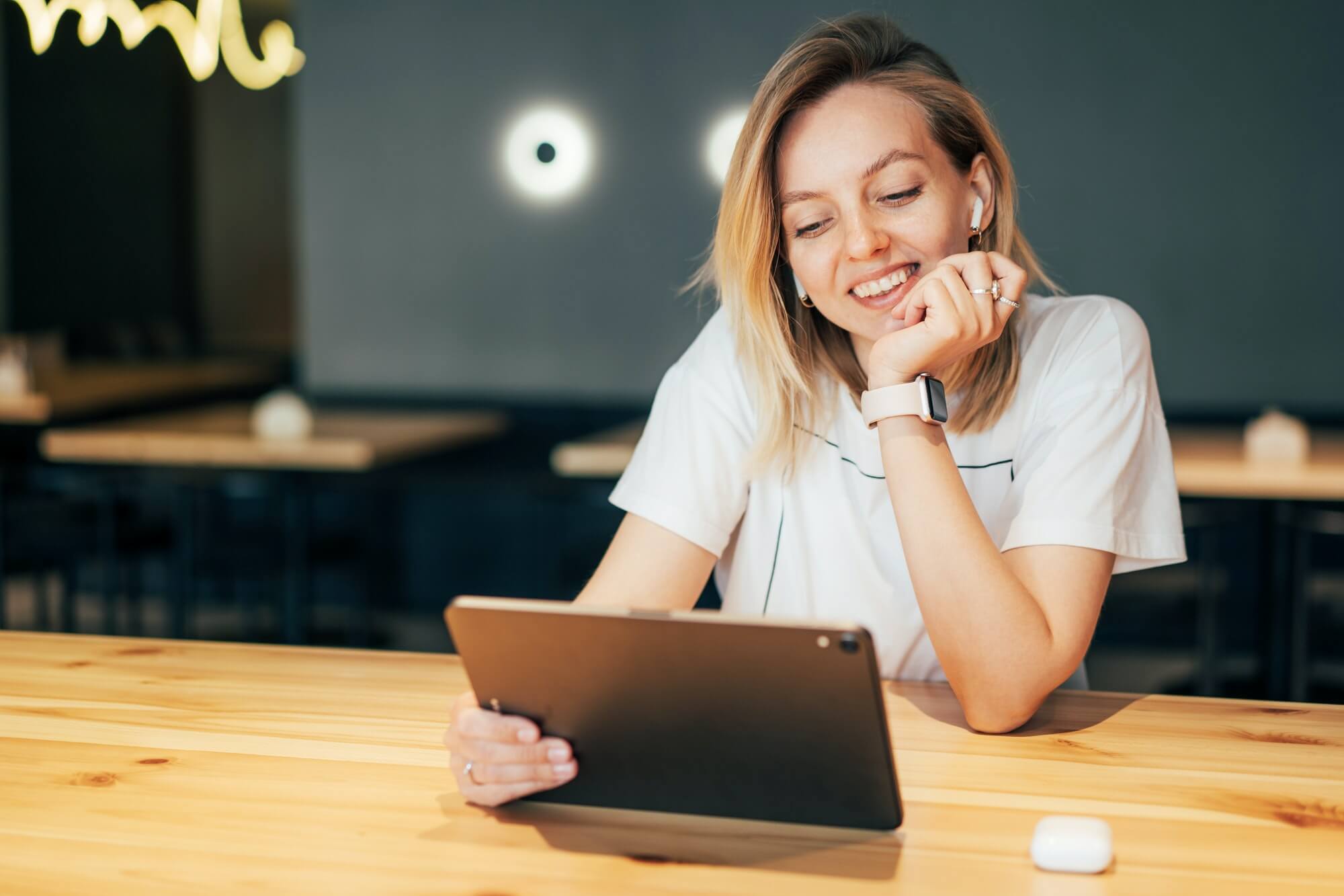 stylish-millennial-woman-working-on-tablet-in-coworking-space-1-1.jpg